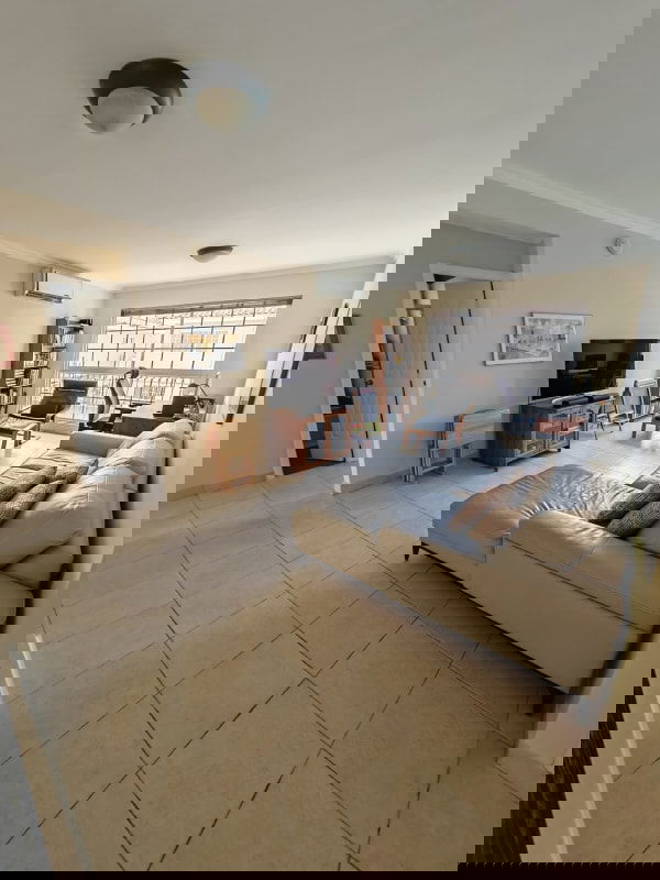 Large living room with tile floors, sectional sofa and windows Costa Azul Panama