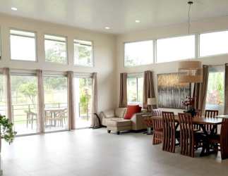 Open-plan living and dining room with natural light in Alto Boquete home Panama
