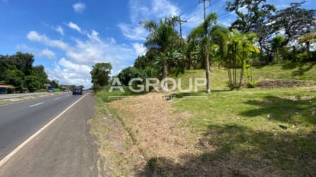 Paved highway with roadside grassy land near Villa Carmen Capira available for development Panama