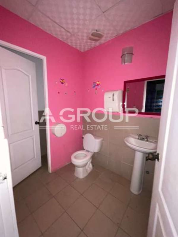 Simple bathroom with sink and toilet inside commercial space Brisas del Golf
