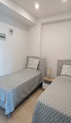 Open living space with balcony access and sea view in Royal Palm Beach condo Panama