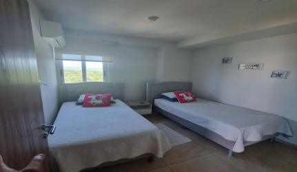 Second bedroom with window and closet in Royal Palm beachfront condo Panama