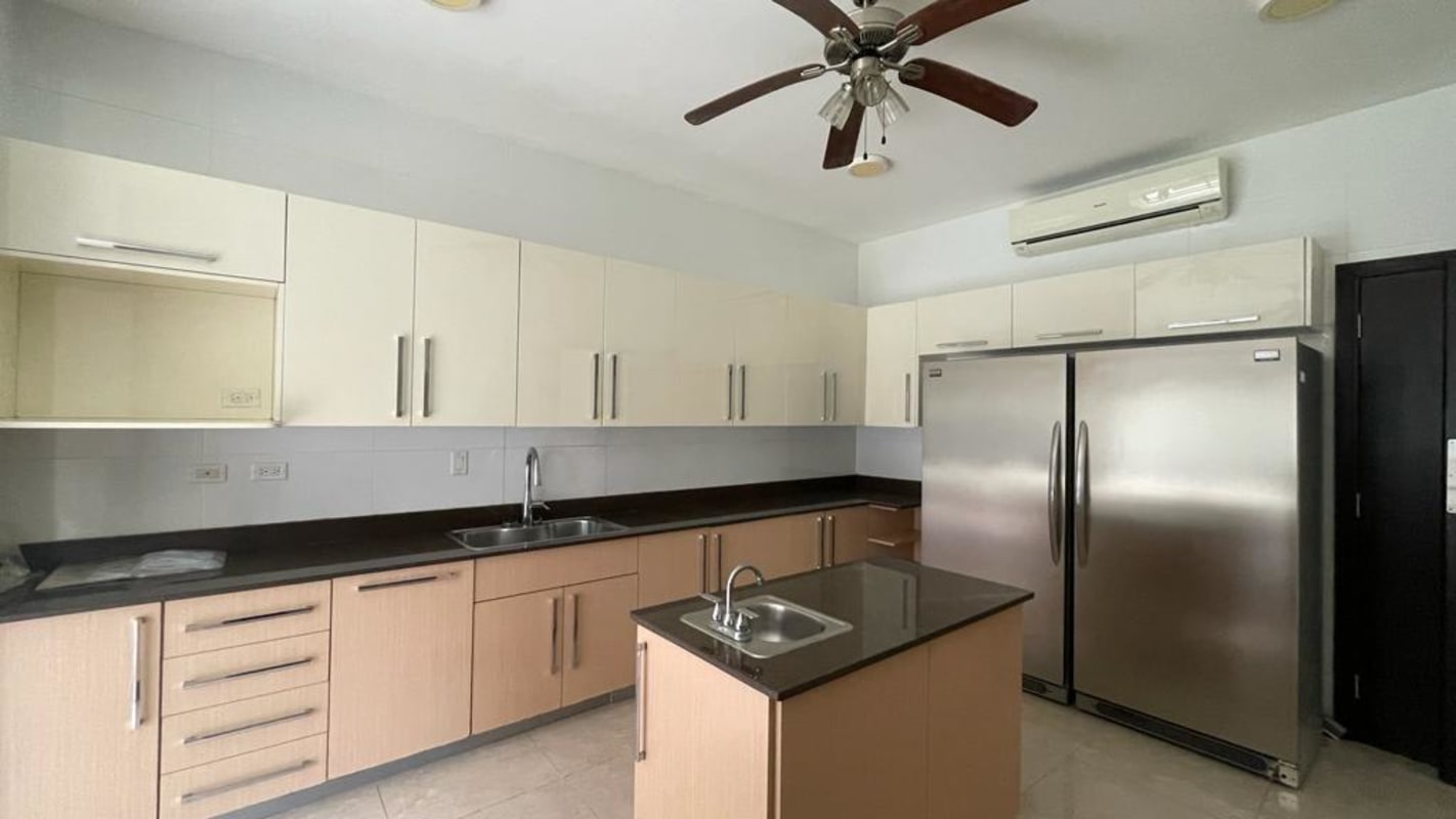 Kitchen with granite central island stainless appliances in PH Los Senderos Clayton Panama