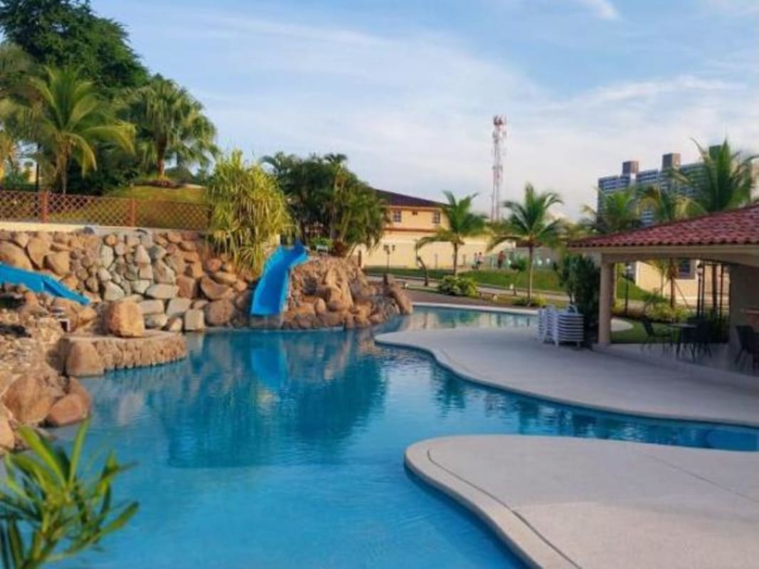 Resort style pool with gazebo, water features and gardens in Dorado Lakes