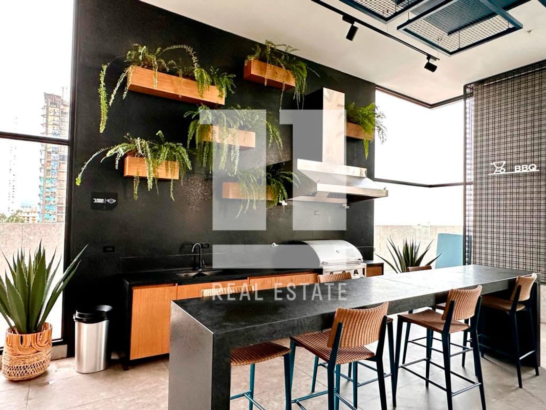 Contemporary rooftop BBQ station with greenery and city views in PH Victory Sport Coco del Mar Panama