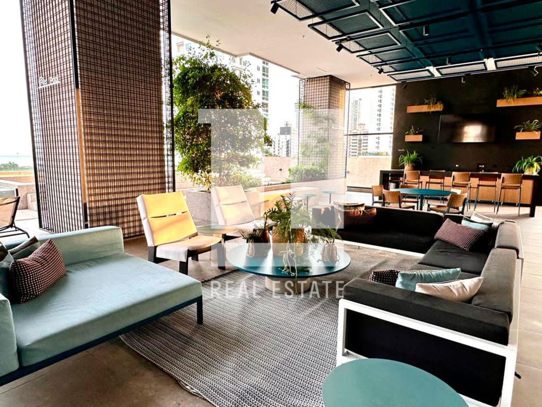 Stylish open-plan social lounge with designer seating and city views at PH Victory Sport Panama