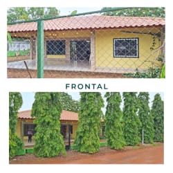 Single floor bungalow with porch, fenced yard, tall trees in Aguadulce Panama for sale