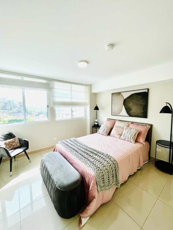 Contemporary bedroom with large window, soft colors and natural light in PH Royal Hills Villa de las Fuentes Panama
