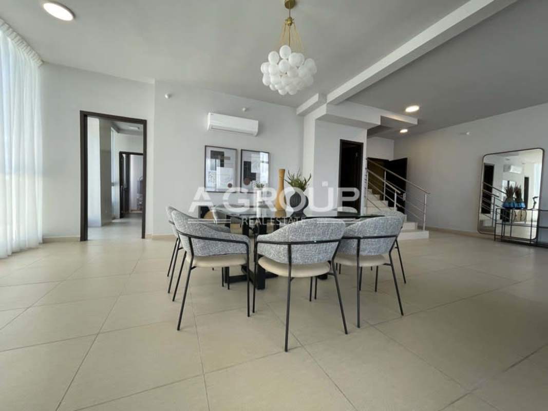 Guest bedroom furnished with large window, closet, en-suite bath PH Country Club Costa del Este Panama