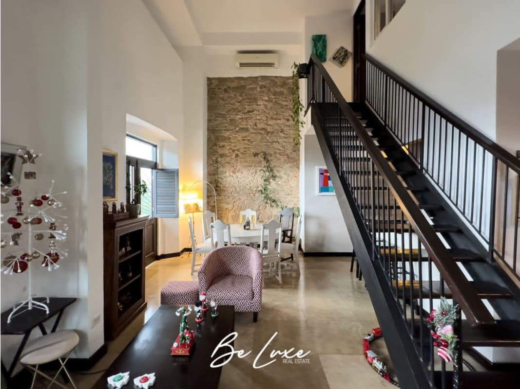Modern rustic open living dining loft with staircase historic walls Casco Viejo Panama