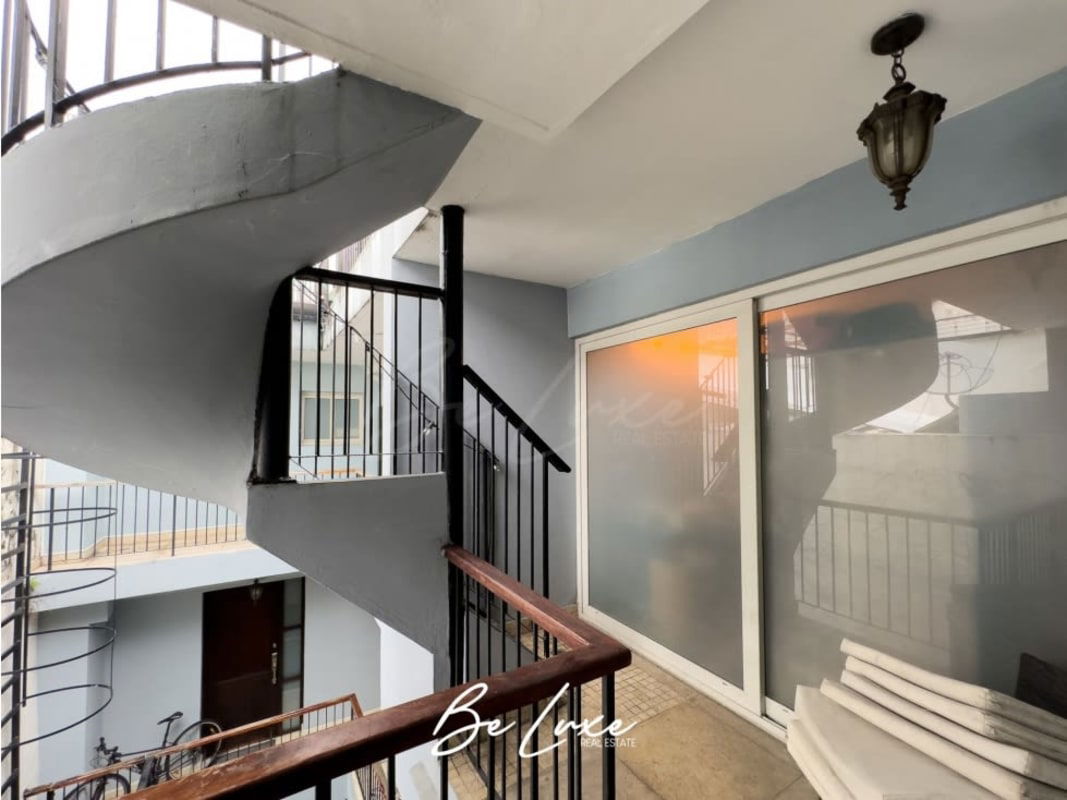 Colonial style spiral staircase and balcony corridor PH Casa Monte Fiore Casco Viejo Panama