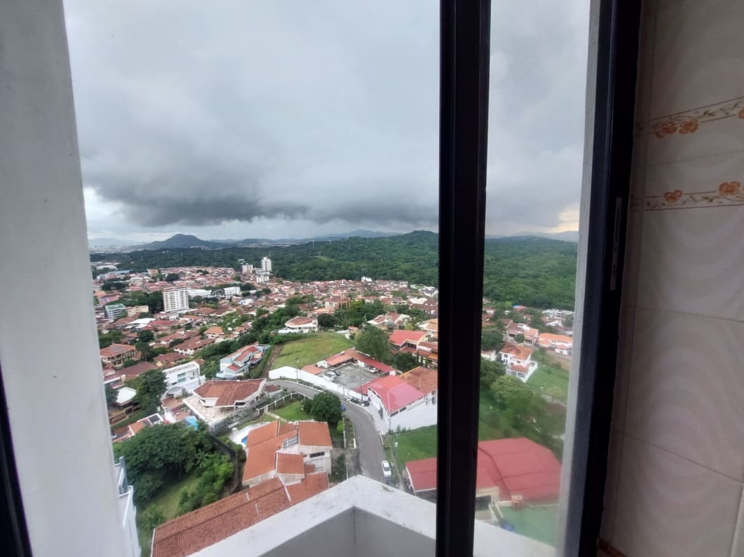 Empty living space with panoramic windows and mountain views PH Pacific Hills Panama