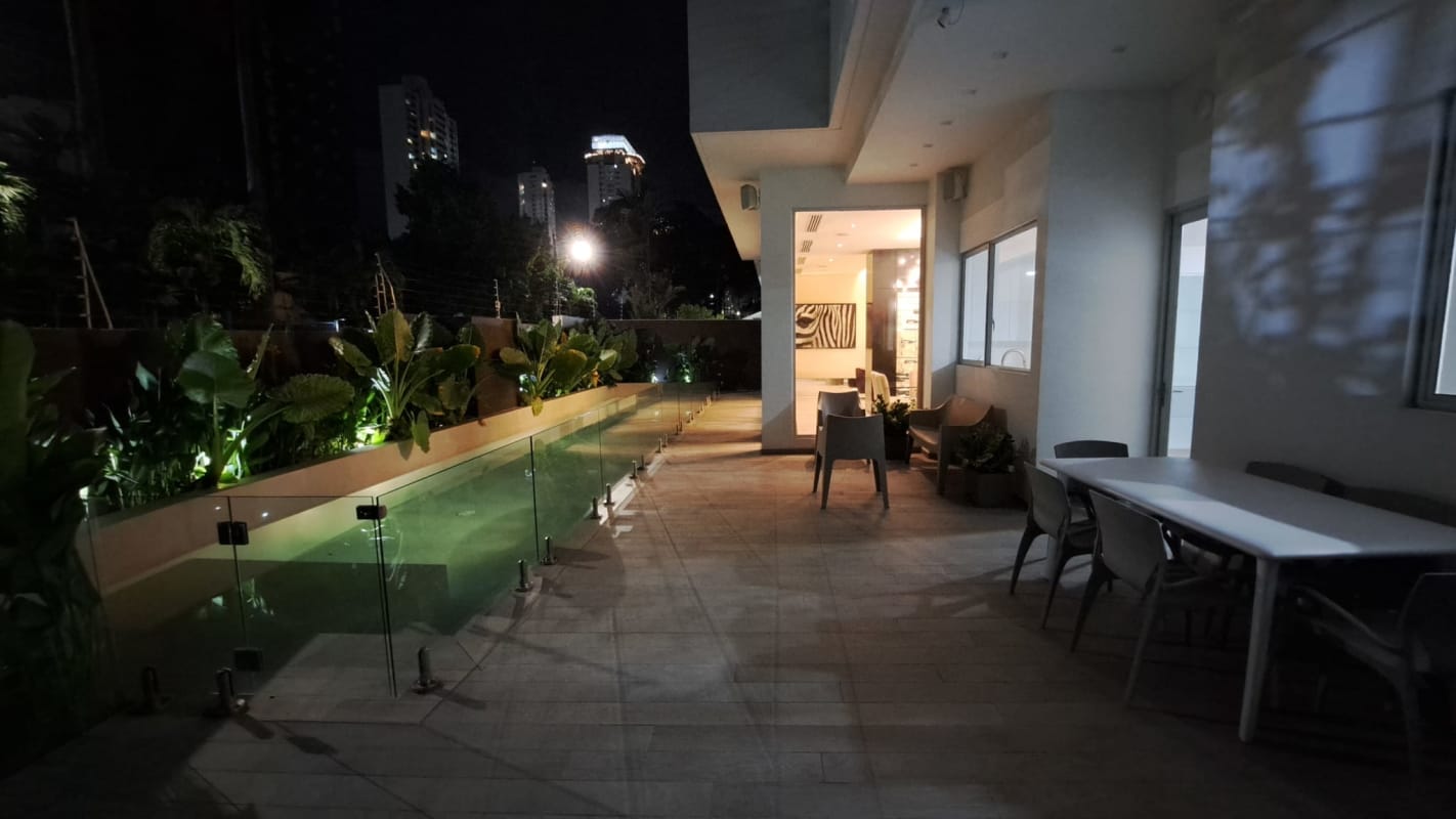 Luxury living room with sectional sofa, art, stone wall and designer lighting Panama City