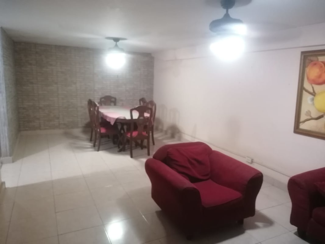 Kitchen with blue cabinets, granite countertop and stainless appliances in La Locería Betania house Panama City