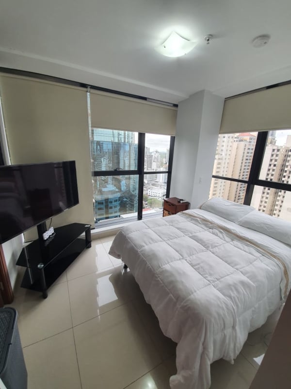 Hallway revealing kitchen area and tiled bathroom PH Downtown Panama City.