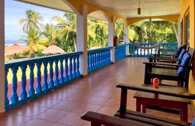 Outdoor spa cabana with massage bed and privacy curtains at beachfront Las Lajas Hotel in Panama