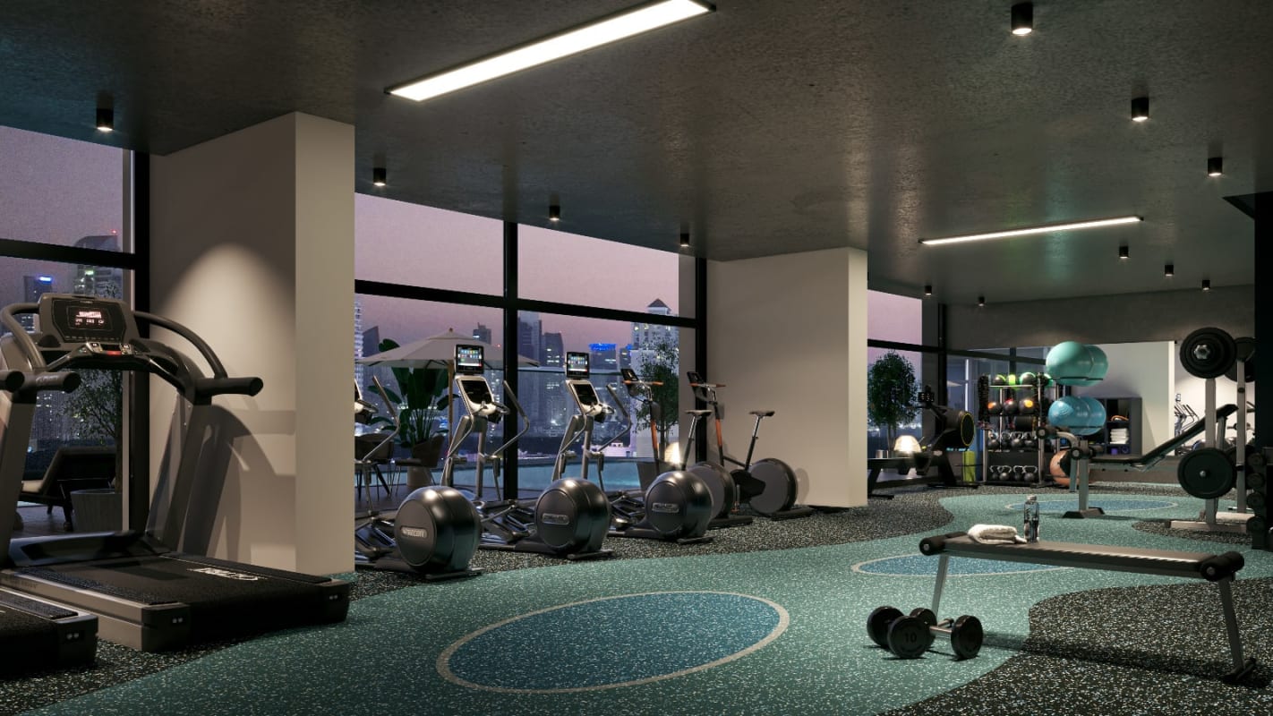 Fully equipped gym with cardio machines overlooking Panama Skyline at PH HUB Condo