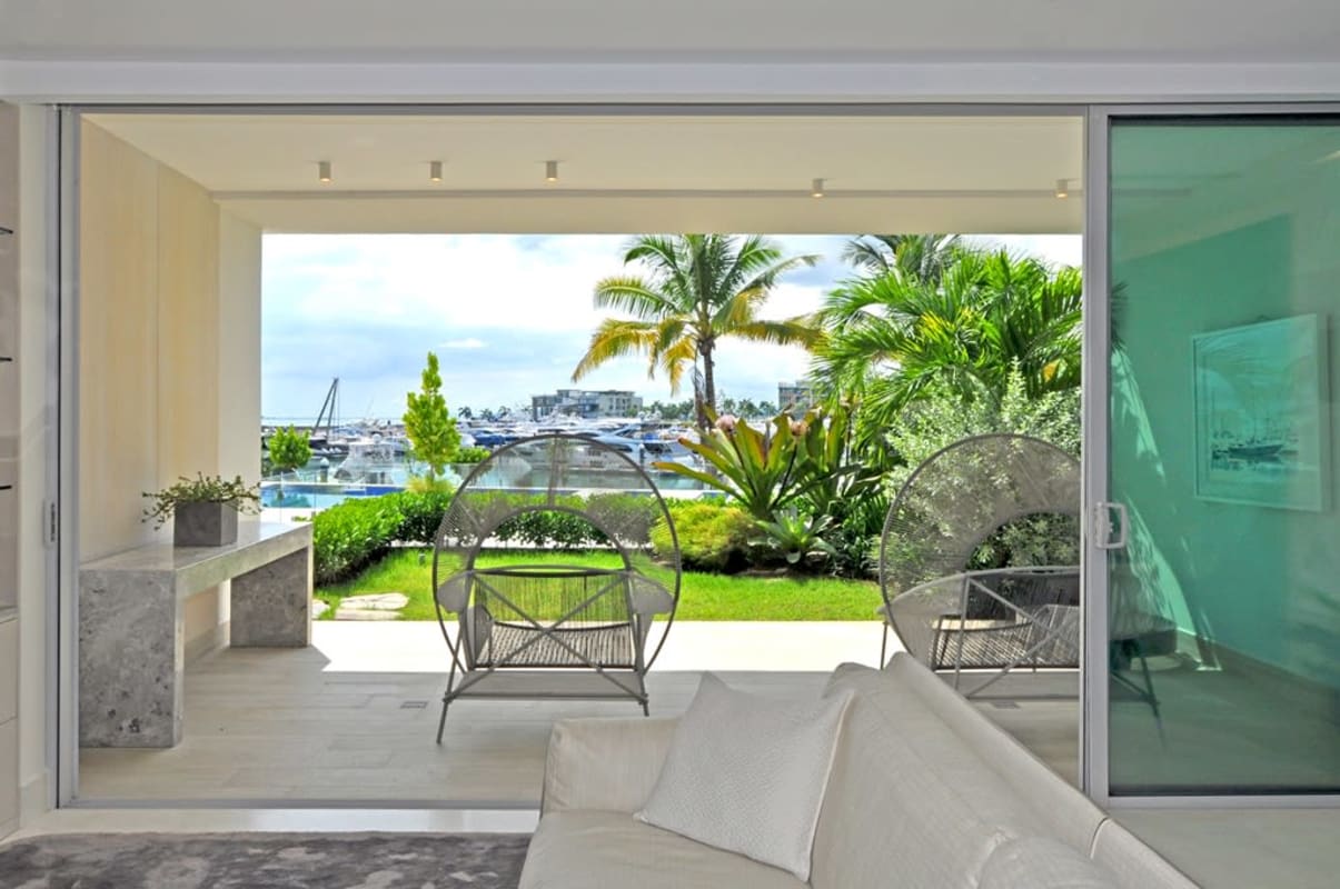 Spacious living room with floor-to-ceiling windows and custom furnishings at Ocean Reef