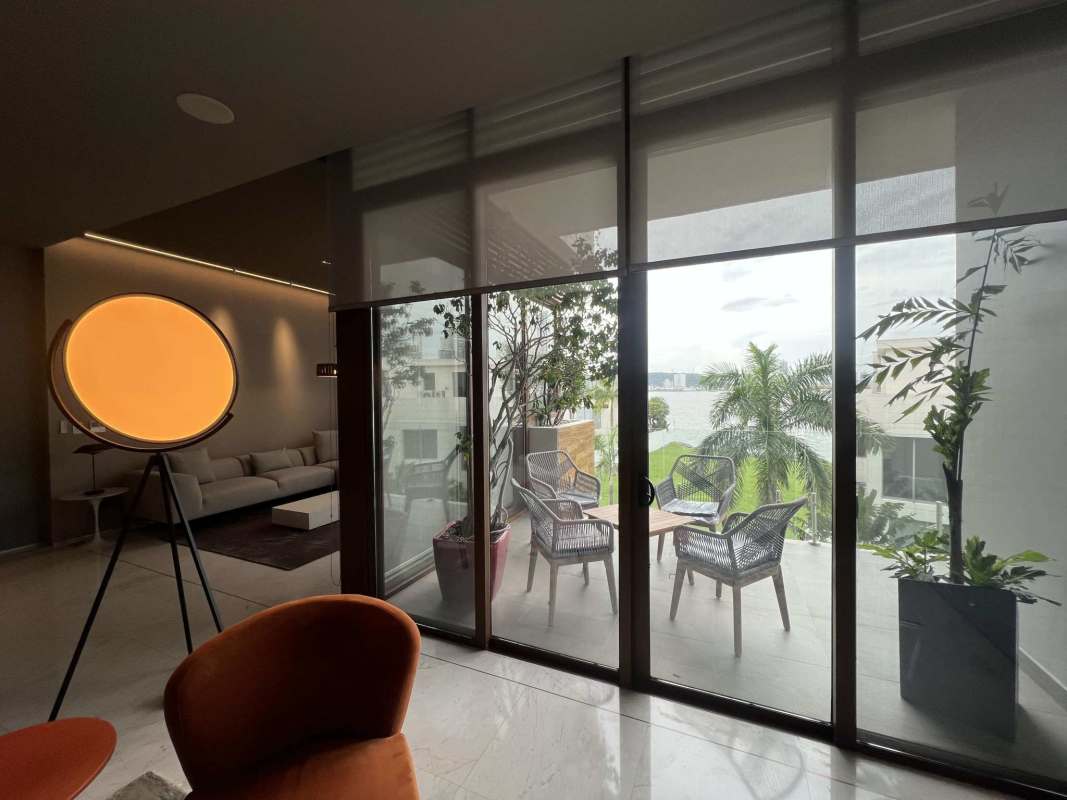 Modern bedroom with floor-to-ceiling windows and marina view in Ocean Reef Islands villa Panama
