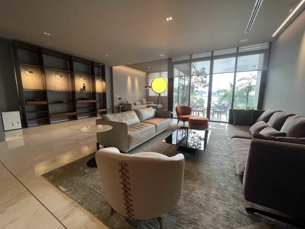 Contemporary living room with floor-to-ceiling glass overlooking Pacific Ocean in luxury villa Ocean Reef Islands Panama