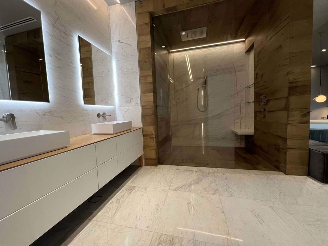 Spacious bathroom with marble walls and modern fixtures in luxury villa Ocean Reef Islands Panama