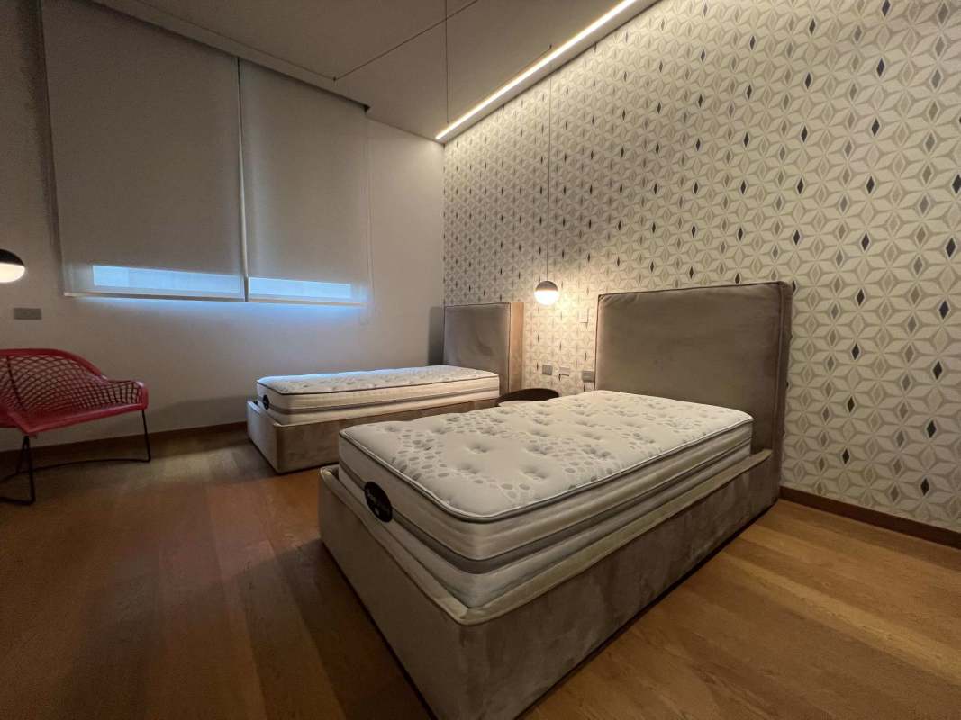 Twin single beds with modern decor in luxury villa Ocean Reef Islands Panama