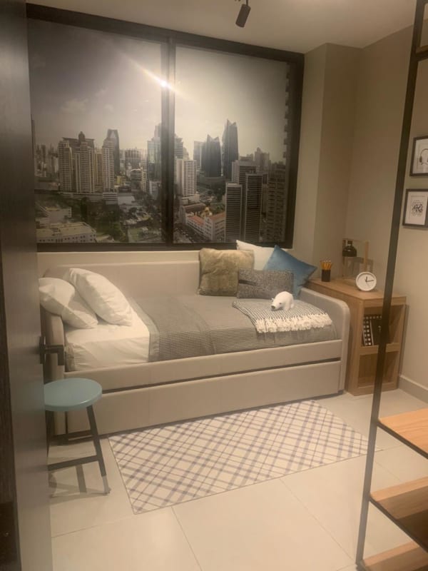 Modern open-plan living room with floor-to-ceiling window city skyline views in PH Nostrum Obarrio Panama City