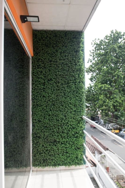 Balcony with vertical green privacy wall and railing Pedregal Urban Complex Panama