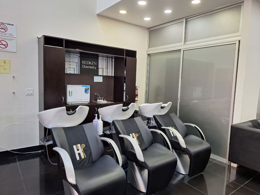 Wash station area with shampoo chairs, cabinetry in commercial salon for sale Costa del Este