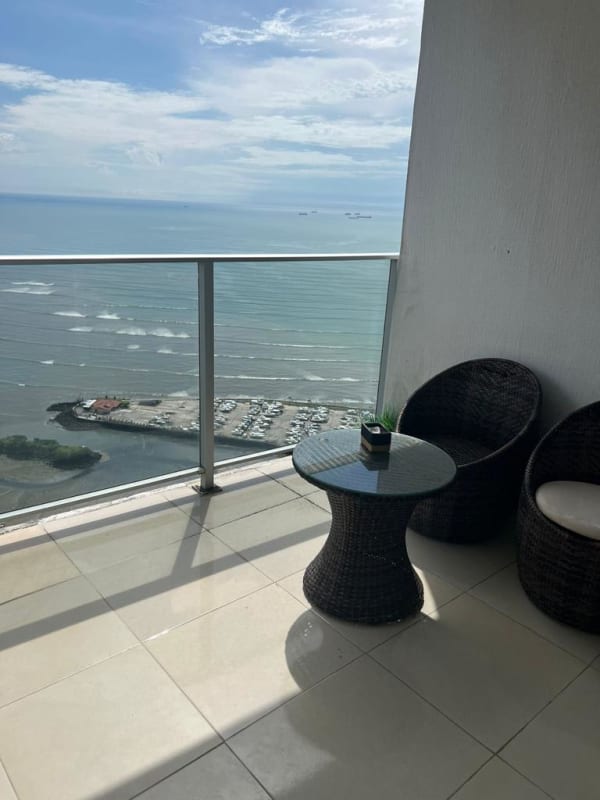 Spacious balcony with seating area and stunning views over the Pacific Ocean in PH BICSA Financial Center Panama City