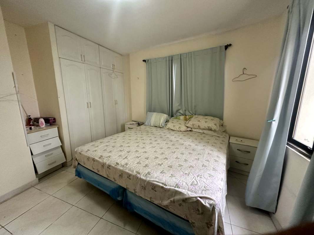 Master bedroom with closet space, cream tile floor in Golden Gate Tower Panama City