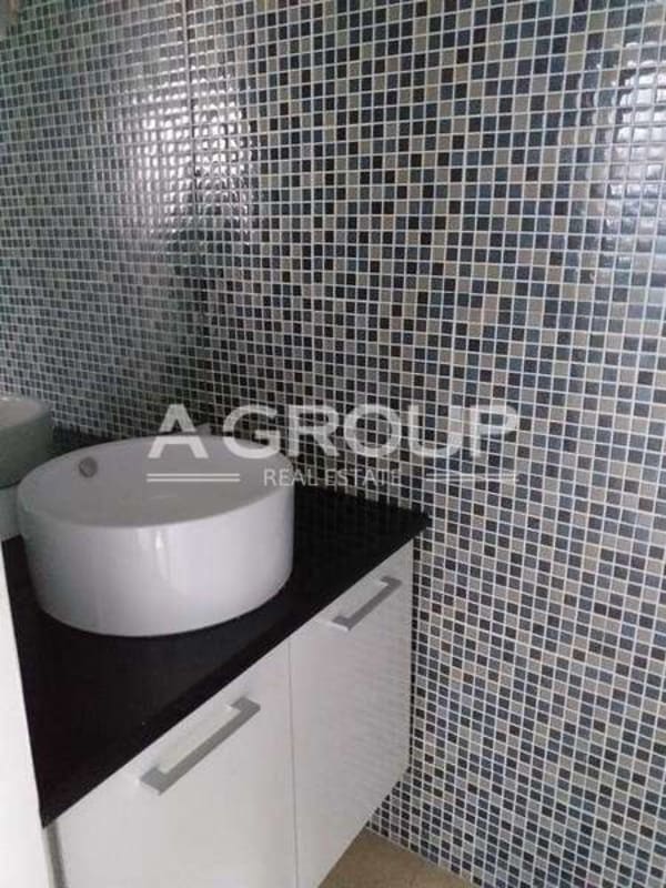 Modern bathroom with mosaic tiles vessel sink commercial office F&F Tower Panama