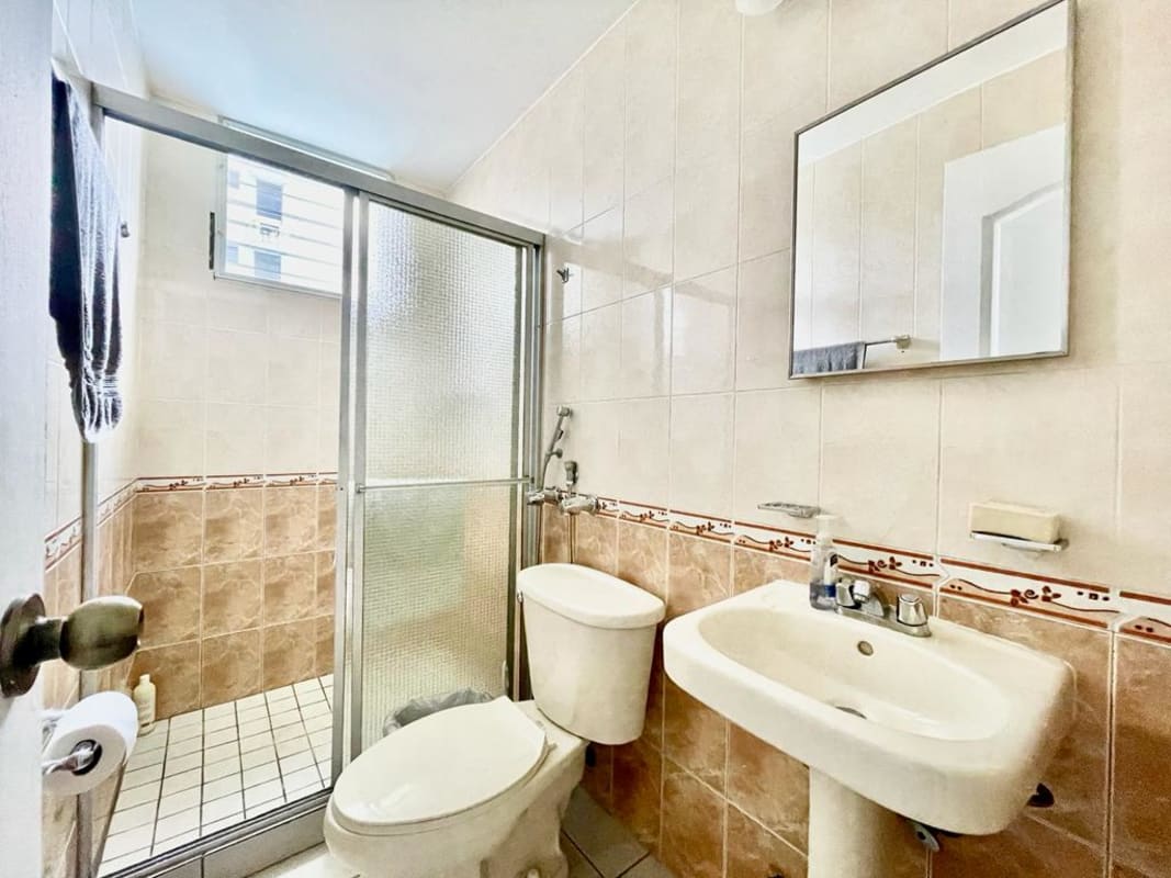 Bedroom featuring split air conditioning, built-in closet and natural light at PH San Francisco Bay Panama