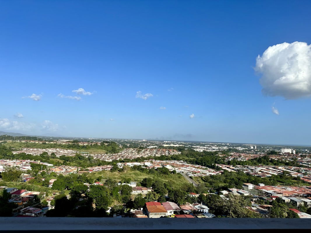Twin high-rise towers of PH Mystic Valley with balconies in El Crisol Panama City