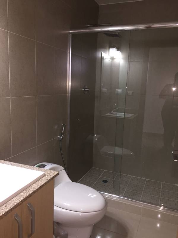 Glass enclosed shower, granite vanity, tile PH Rokas Condado del Rey Panama