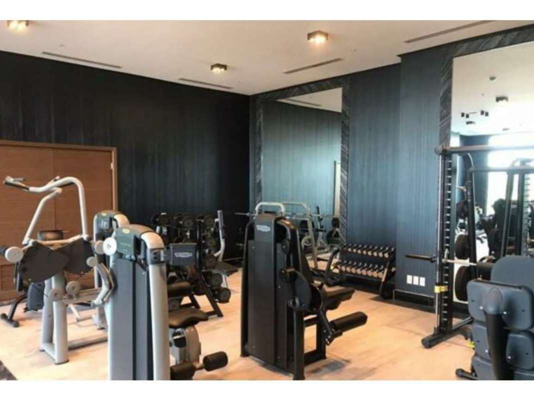 Luxury bedroom with marble flooring, walk-in closet, ensuite bath, panoramic golf course view in Empire Residences Panama