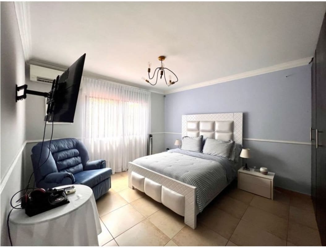 Master bedroom suite with sitting area natural light in luxury home clayton village panama