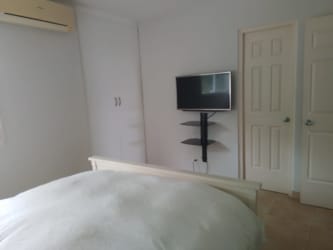 Second bedroom with built-in closet, air conditioning, two twins beds in Playa Blanca Resort condo