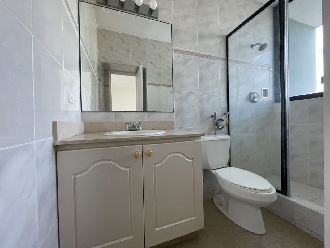 Bathroom with double sink vanities marble tiles glass shower PH Miramar Panama