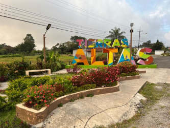 Colorful entrance sign Tierras Altas landmark near Volcán Panama for sale land