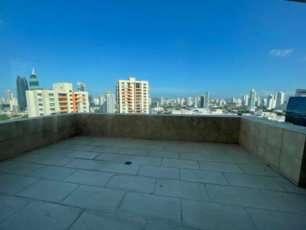 Modern living room with floor-to-ceiling windows overlooking Panama City skyline PH Costa Pacifica