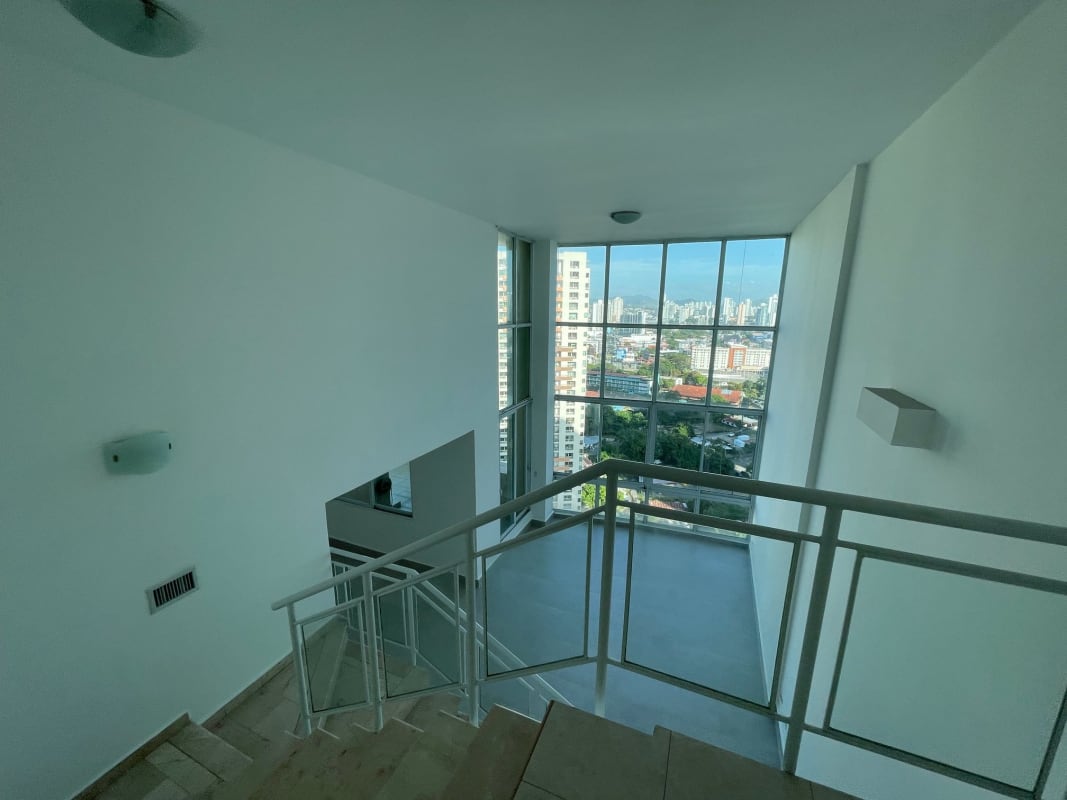 Interior landing staircase large windows panoramic views PH Costa Pacifica Panama City