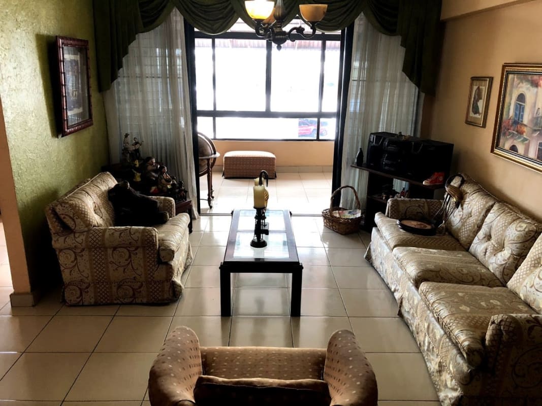 Spacious living room with large window balcony access PH Los Mellizos Panama City