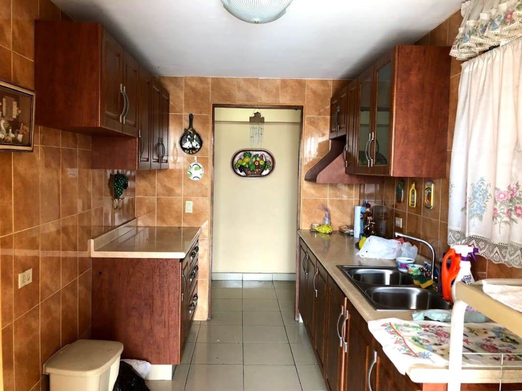 Double sink wooden cabinets ceramic tile floor kitchen PH Los Mellizos Panama