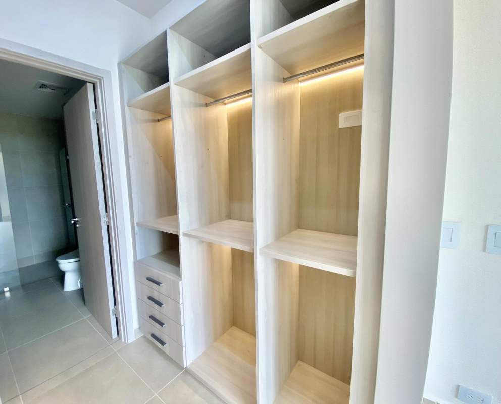 Spacious walk-in closet with modern shelving at Ocean House Santa María Panama