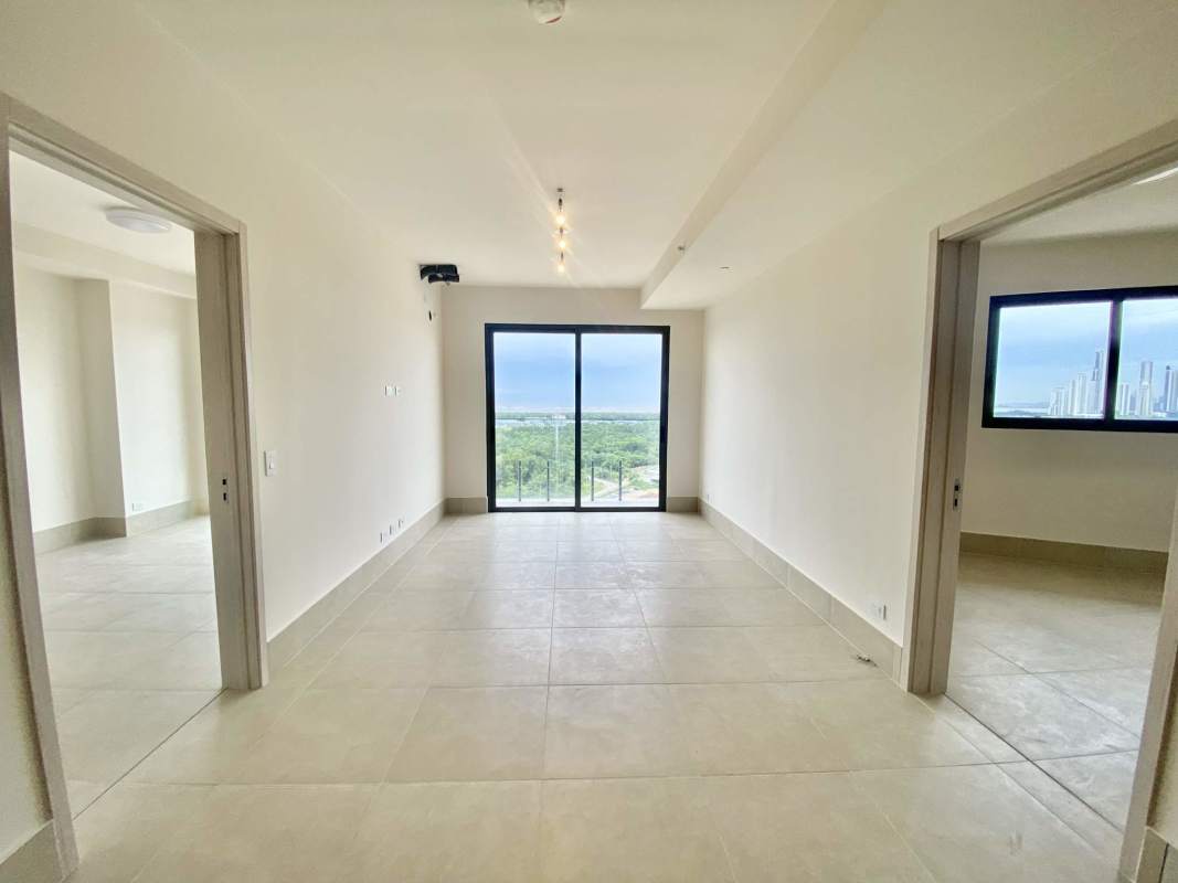 Spacious bright living room with floor-to-ceiling doors to balcony Ocean House Panama