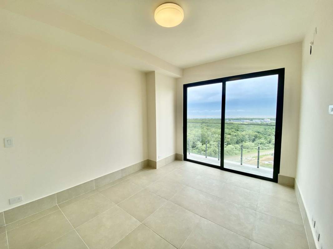 Bright living dining room opening to balcony with panoramic views Ocean House Panama