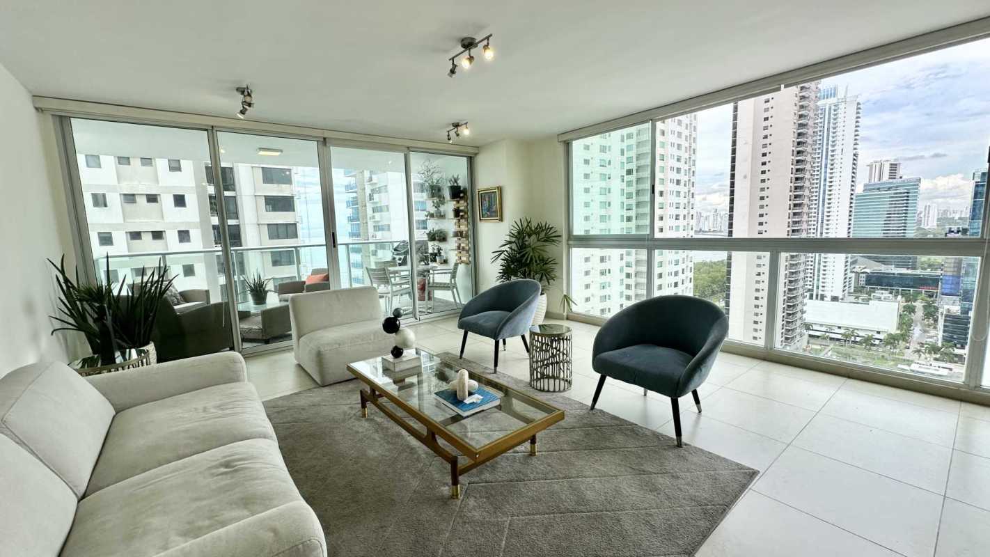 Modern open living room with panoramic windows ocean and skyline views PH Lumiere Costa del Este Panama