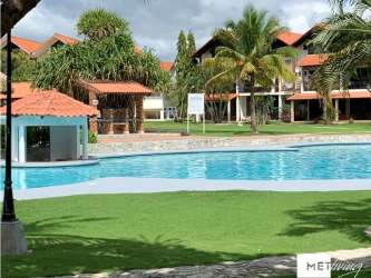 Entrance with stone walls and landscaping at Brisas de Coronado gated community Panama