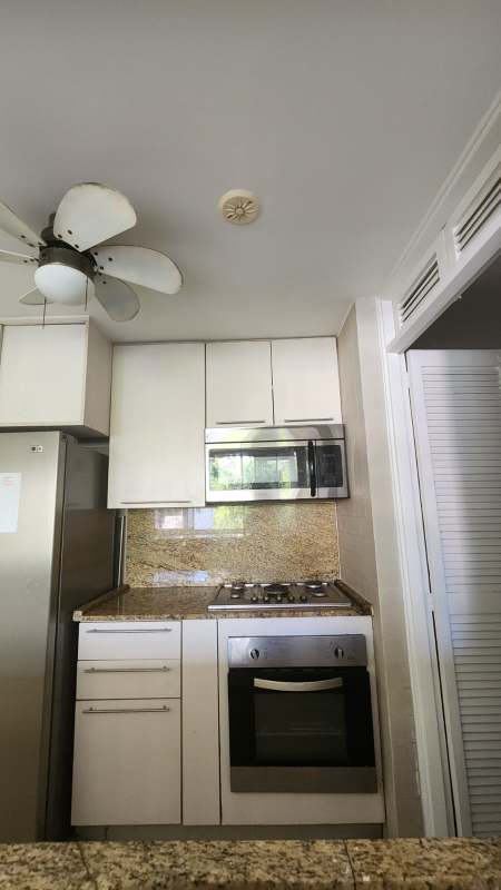 Bedroom with tiled floor, window, closet, and ceiling fan at PH Plaza Dos Mares Dos Mares Panama